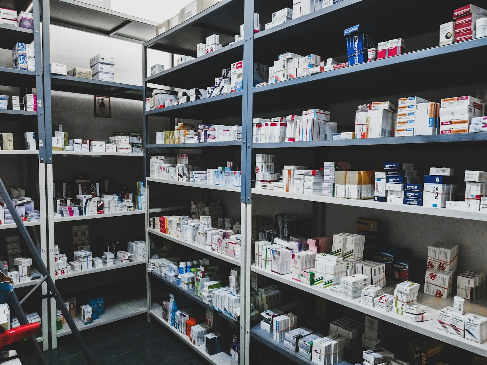 Shelves of boxed medicines in a storeroom